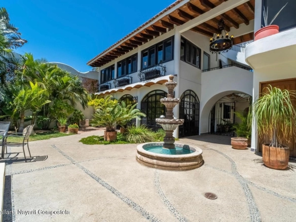 Front view of Hacienda Katherine Sayulita showcasing authentic Mexican architecture and tropical gardens