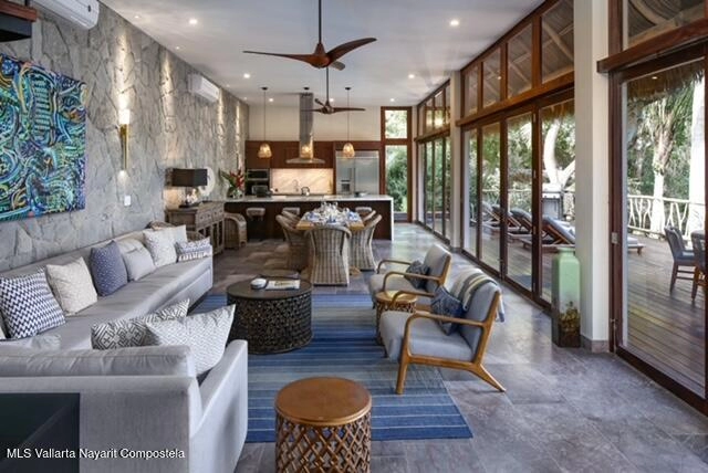 ving room of Casa Las Hijas Sayulita with parota wood finishes