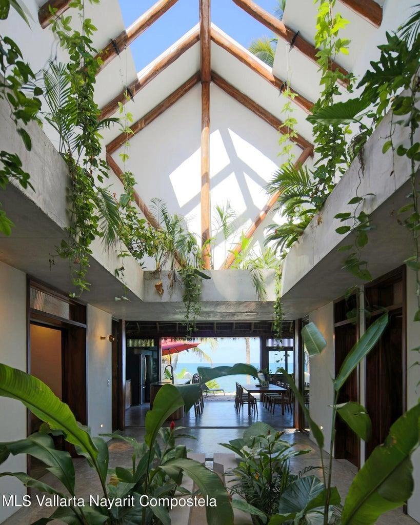 Casa Mirlo 14 Casa Mirlo is an exceptional Sayulita beachfront home for sale and one of the few true beachfront properties available in Sayulita. Offering unmatched location and privacy, this recently renovated three-bedroom residence sits just steps from the sand within the exclusive Las Gemelas complex, a boutique community of only six homes on the highly desirable north side of Sayulita. This rare Sayulita real estate opportunity features a modern chef’s kitchen, outdoor patio, cozy indoor terrace, interior fountain, lush gardens, and generous storage throughout. All three bedrooms include en suite bathrooms, providing comfort and privacy for both owners and guests. Located next to the pool and directly beachfront, Casa Mirlo offers immediate access to the ocean while remaining just a five-minute walk to the town center, restaurants, and main beach. As one of the limited beachfront homes in Sayulita, this property represents a unique opportunity for buyers seeking a Sayulita beachfront property, whether for a private residence, vacation home, or high-performing investment in the growing Sayulita real estate market.