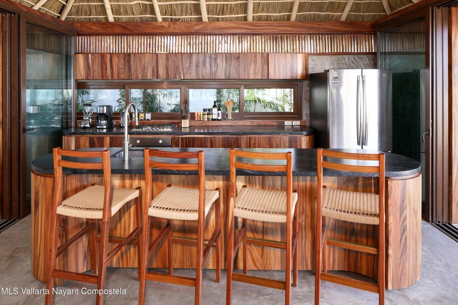 Casa Mirlo 17 Casa Mirlo is an exceptional Sayulita beachfront home for sale and one of the few true beachfront properties available in Sayulita. Offering unmatched location and privacy, this recently renovated three-bedroom residence sits just steps from the sand within the exclusive Las Gemelas complex, a boutique community of only six homes on the highly desirable north side of Sayulita. This rare Sayulita real estate opportunity features a modern chef’s kitchen, outdoor patio, cozy indoor terrace, interior fountain, lush gardens, and generous storage throughout. All three bedrooms include en suite bathrooms, providing comfort and privacy for both owners and guests. Located next to the pool and directly beachfront, Casa Mirlo offers immediate access to the ocean while remaining just a five-minute walk to the town center, restaurants, and main beach. As one of the limited beachfront homes in Sayulita, this property represents a unique opportunity for buyers seeking a Sayulita beachfront property, whether for a private residence, vacation home, or high-performing investment in the growing Sayulita real estate market.