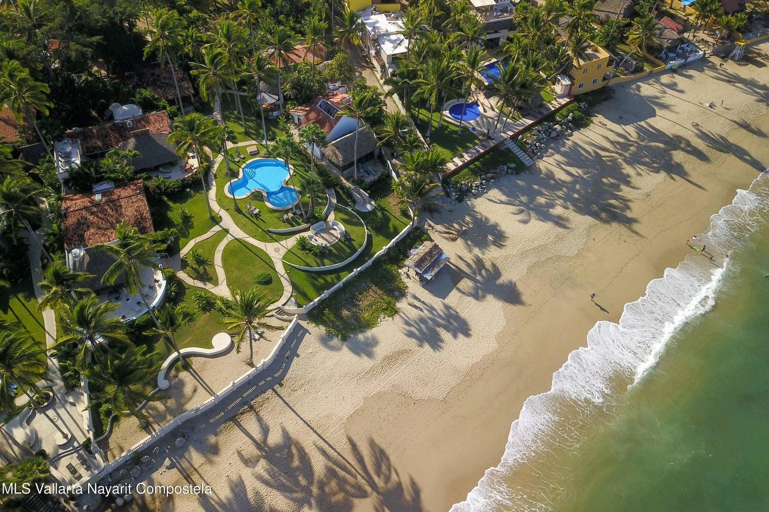 Casa Mirlo 2 Casa Mirlo is an exceptional Sayulita beachfront home for sale and one of the few true beachfront properties available in Sayulita. Offering unmatched location and privacy, this recently renovated three-bedroom residence sits just steps from the sand within the exclusive Las Gemelas complex, a boutique community of only six homes on the highly desirable north side of Sayulita. This rare Sayulita real estate opportunity features a modern chef’s kitchen, outdoor patio, cozy indoor terrace, interior fountain, lush gardens, and generous storage throughout. All three bedrooms include en suite bathrooms, providing comfort and privacy for both owners and guests. Located next to the pool and directly beachfront, Casa Mirlo offers immediate access to the ocean while remaining just a five-minute walk to the town center, restaurants, and main beach. As one of the limited beachfront homes in Sayulita, this property represents a unique opportunity for buyers seeking a Sayulita beachfront property, whether for a private residence, vacation home, or high-performing investment in the growing Sayulita real estate market.