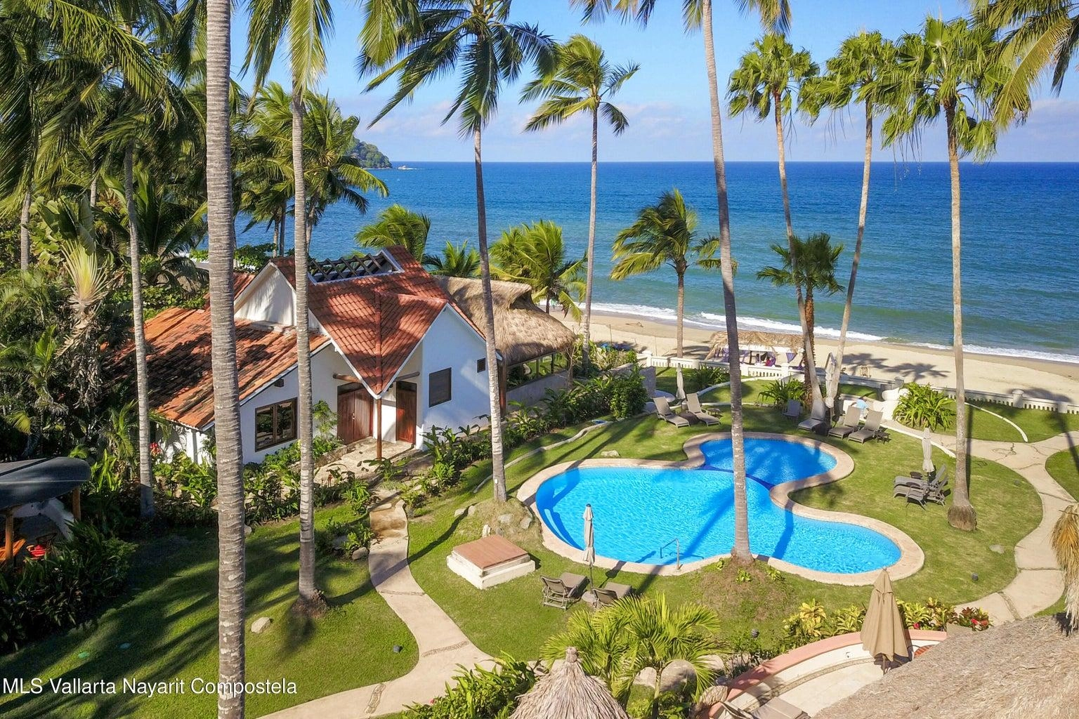 Casa Mirlo 23 Casa Mirlo is an exceptional Sayulita beachfront home for sale and one of the few true beachfront properties available in Sayulita. Offering unmatched location and privacy, this recently renovated three-bedroom residence sits just steps from the sand within the exclusive Las Gemelas complex, a boutique community of only six homes on the highly desirable north side of Sayulita. This rare Sayulita real estate opportunity features a modern chef’s kitchen, outdoor patio, cozy indoor terrace, interior fountain, lush gardens, and generous storage throughout. All three bedrooms include en suite bathrooms, providing comfort and privacy for both owners and guests. Located next to the pool and directly beachfront, Casa Mirlo offers immediate access to the ocean while remaining just a five-minute walk to the town center, restaurants, and main beach. As one of the limited beachfront homes in Sayulita, this property represents a unique opportunity for buyers seeking a Sayulita beachfront property, whether for a private residence, vacation home, or high-performing investment in the growing Sayulita real estate market.