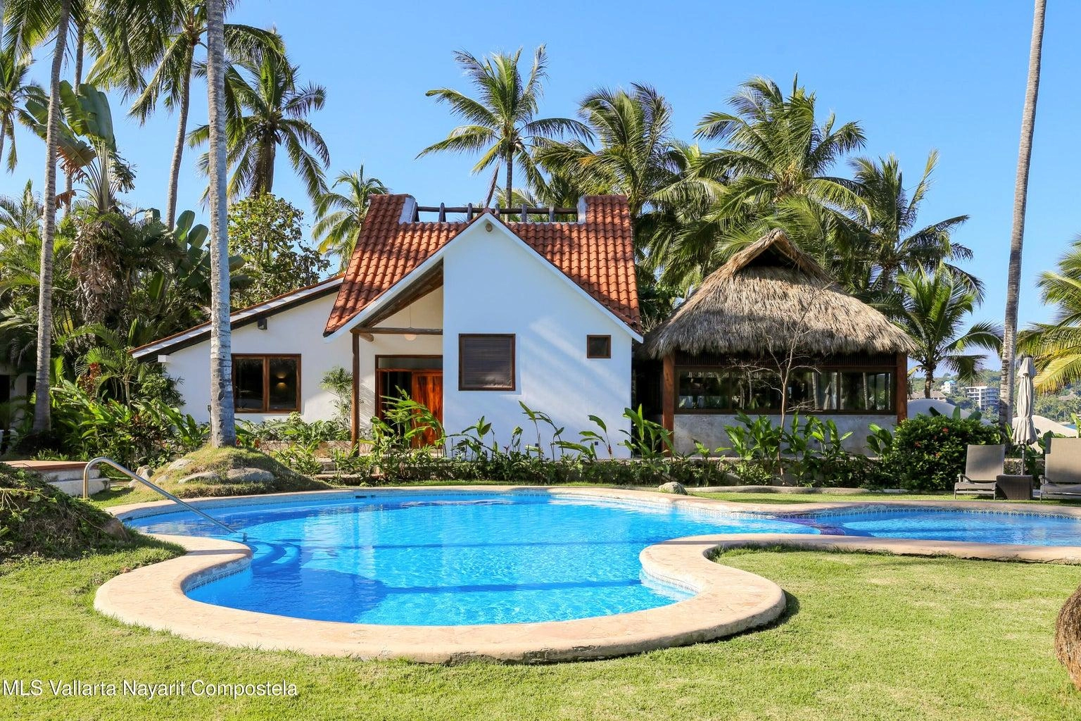 Casa Mirlo 4 Casa Mirlo is an exceptional Sayulita beachfront home for sale and one of the few true beachfront properties available in Sayulita. Offering unmatched location and privacy, this recently renovated three-bedroom residence sits just steps from the sand within the exclusive Las Gemelas complex, a boutique community of only six homes on the highly desirable north side of Sayulita. This rare Sayulita real estate opportunity features a modern chef’s kitchen, outdoor patio, cozy indoor terrace, interior fountain, lush gardens, and generous storage throughout. All three bedrooms include en suite bathrooms, providing comfort and privacy for both owners and guests. Located next to the pool and directly beachfront, Casa Mirlo offers immediate access to the ocean while remaining just a five-minute walk to the town center, restaurants, and main beach. As one of the limited beachfront homes in Sayulita, this property represents a unique opportunity for buyers seeking a Sayulita beachfront property, whether for a private residence, vacation home, or high-performing investment in the growing Sayulita real estate market.