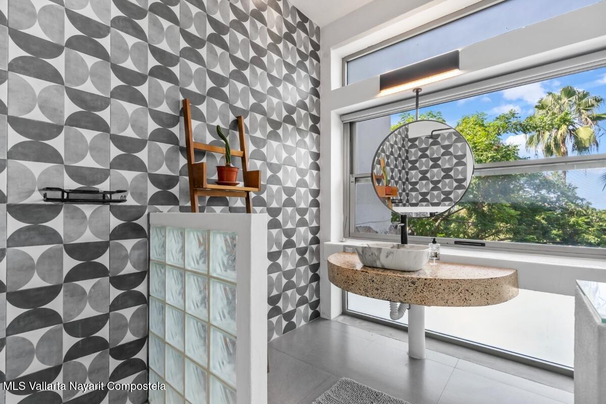 Modern luxury villa in Sayulita with panoramic Pacific Ocean views and contemporary concrete architecture.