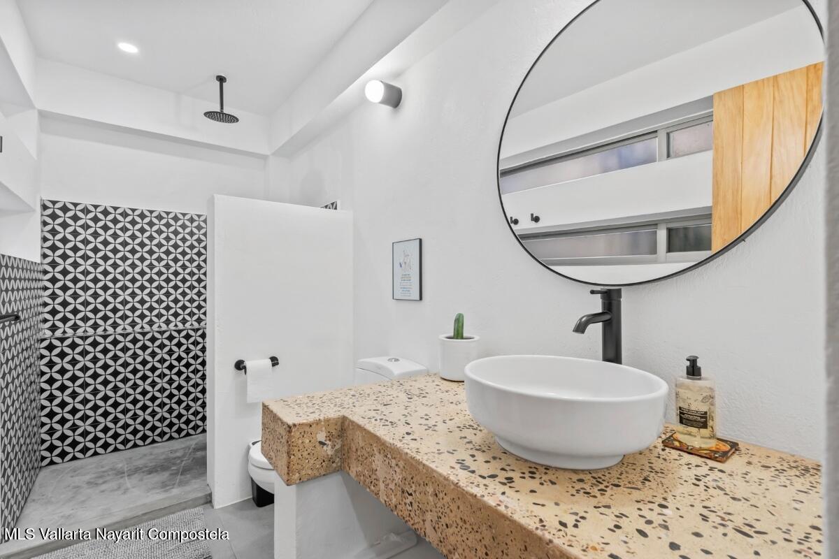 Modern luxury villa in Sayulita with panoramic Pacific Ocean views and contemporary concrete architecture.