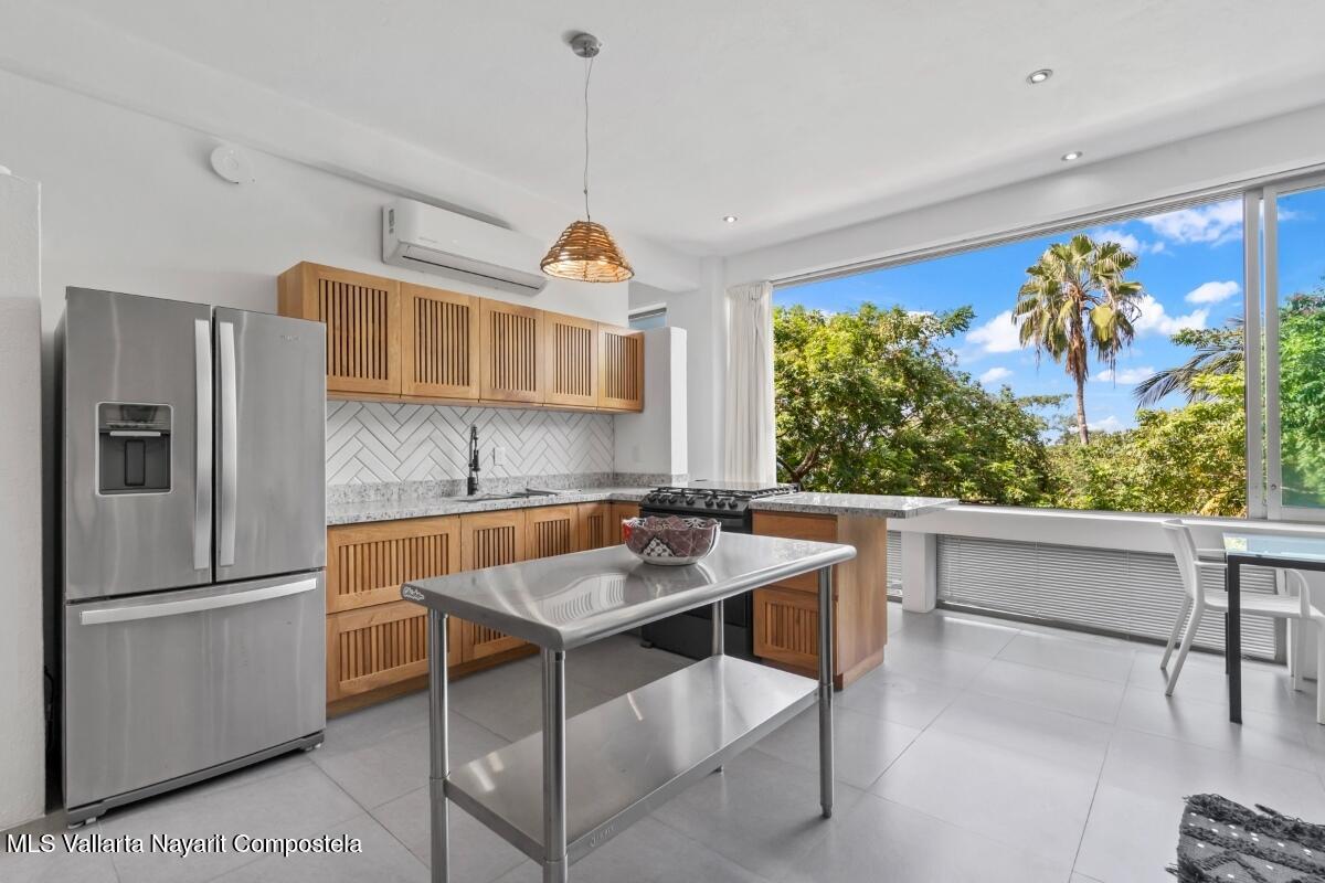 Modern luxury villa in Sayulita with panoramic Pacific Ocean views and contemporary concrete architecture.