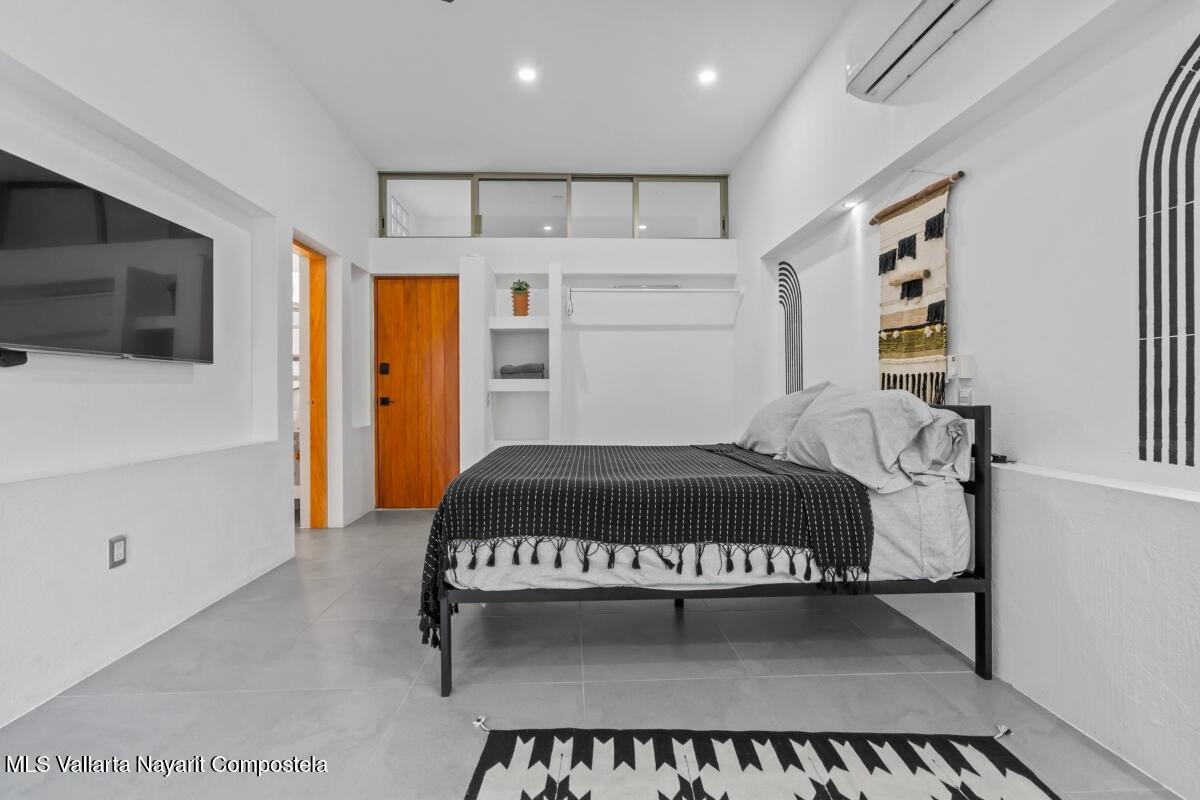 Modern luxury villa in Sayulita with panoramic Pacific Ocean views and contemporary concrete architecture.