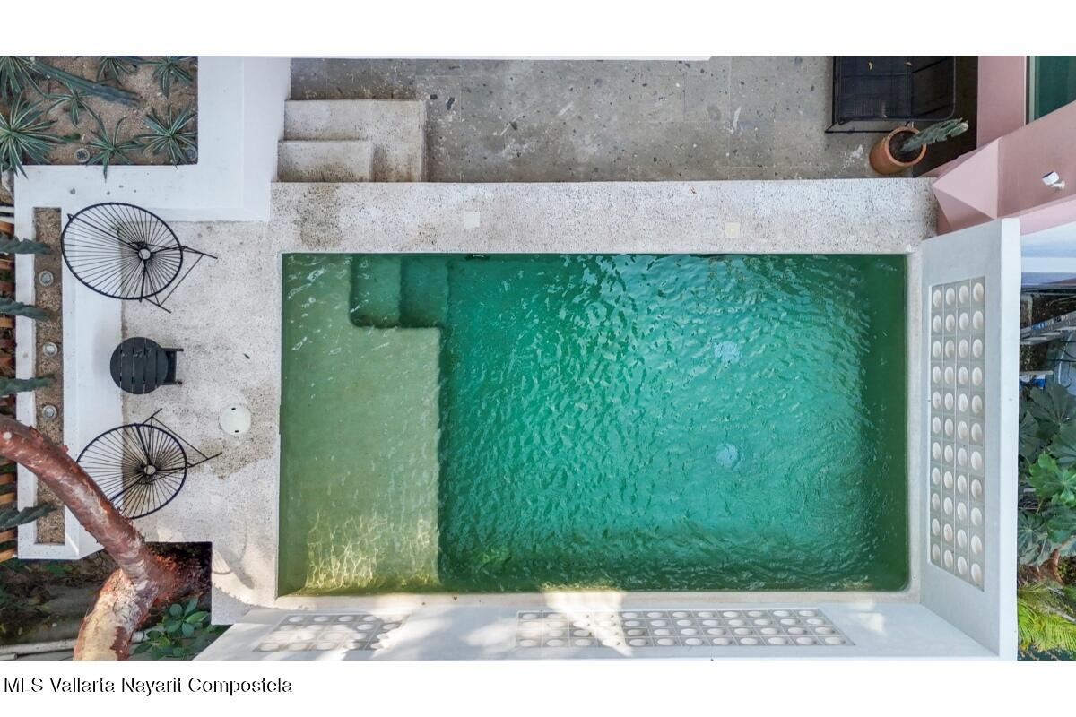 Modern luxury villa in Sayulita with panoramic Pacific Ocean views and contemporary concrete architecture.