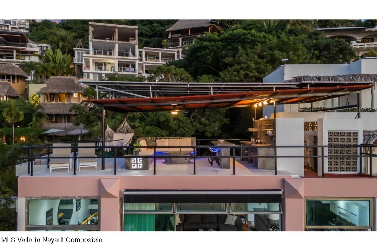 Modern luxury villa in Sayulita with panoramic Pacific Ocean views and contemporary concrete architecture.