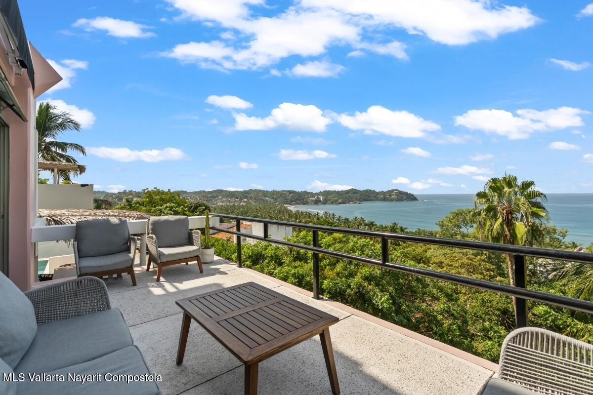 Modern luxury villa in Sayulita with panoramic Pacific Ocean views and contemporary concrete architecture.