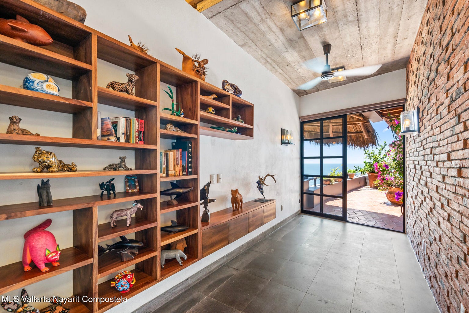Luxury ocean view home for sale in Nanzal Hill, Sayulita featuring panoramic Pacific Ocean views, tropical landscaping, saltwater pool, rooftop terrace, gourmet kitchen, and elegant indoor-outdoor coastal living in Riviera Nayarit.