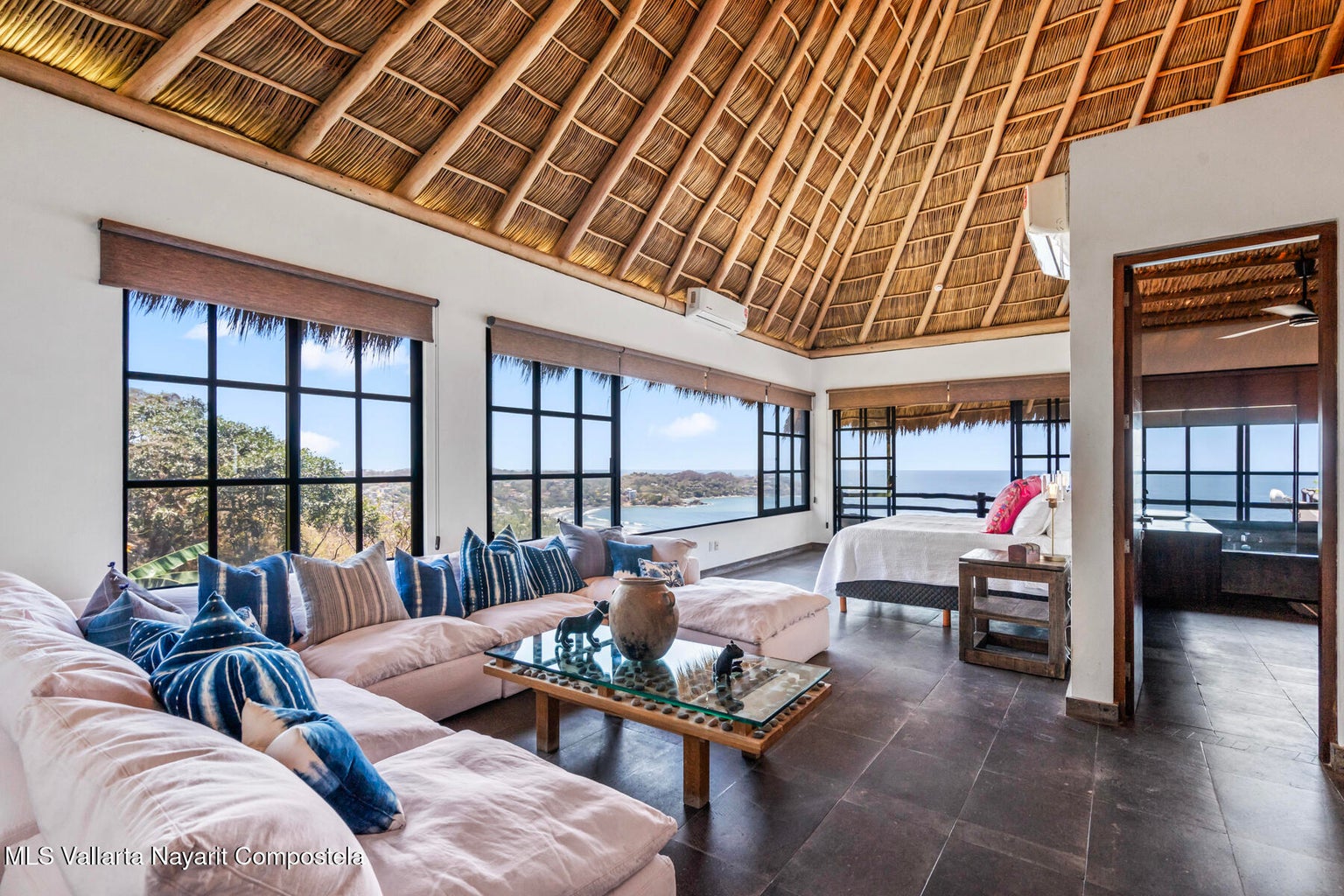 Luxury ocean view home for sale in Nanzal Hill, Sayulita featuring panoramic Pacific Ocean views, tropical landscaping, saltwater pool, rooftop terrace, gourmet kitchen, and elegant indoor-outdoor coastal living in Riviera Nayarit.