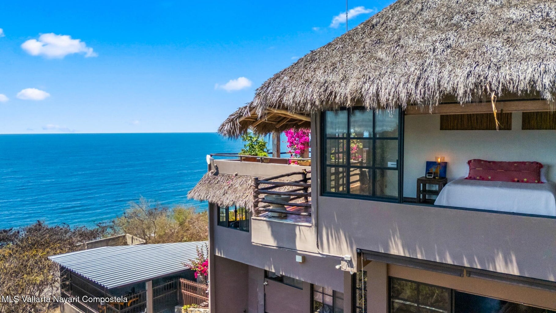 Luxury ocean view home for sale in Nanzal Hill, Sayulita featuring panoramic Pacific Ocean views, tropical landscaping, saltwater pool, rooftop terrace, gourmet kitchen, and elegant indoor-outdoor coastal living in Riviera Nayarit.