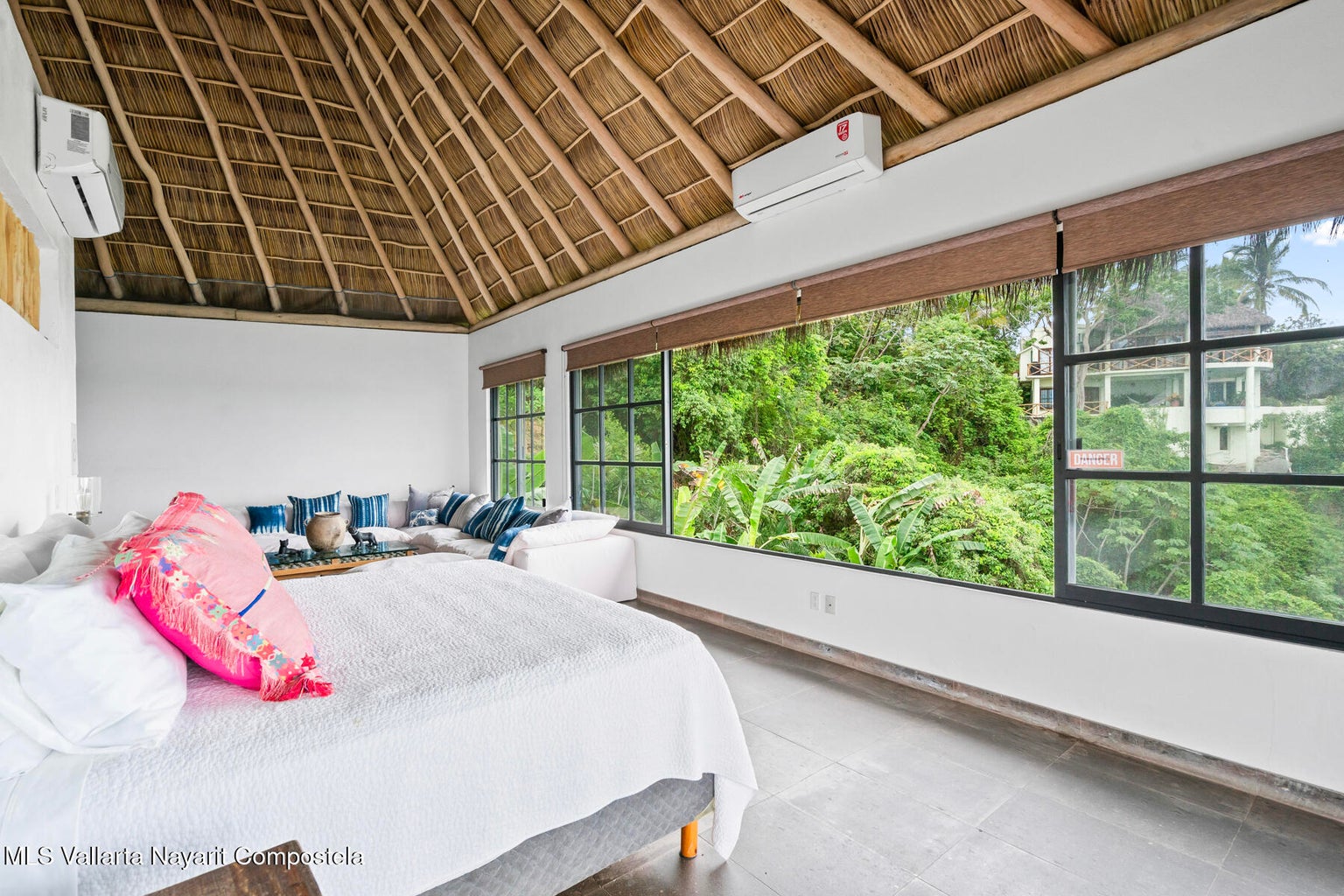Luxury ocean view home for sale in Nanzal Hill, Sayulita featuring panoramic Pacific Ocean views, tropical landscaping, saltwater pool, rooftop terrace, gourmet kitchen, and elegant indoor-outdoor coastal living in Riviera Nayarit.