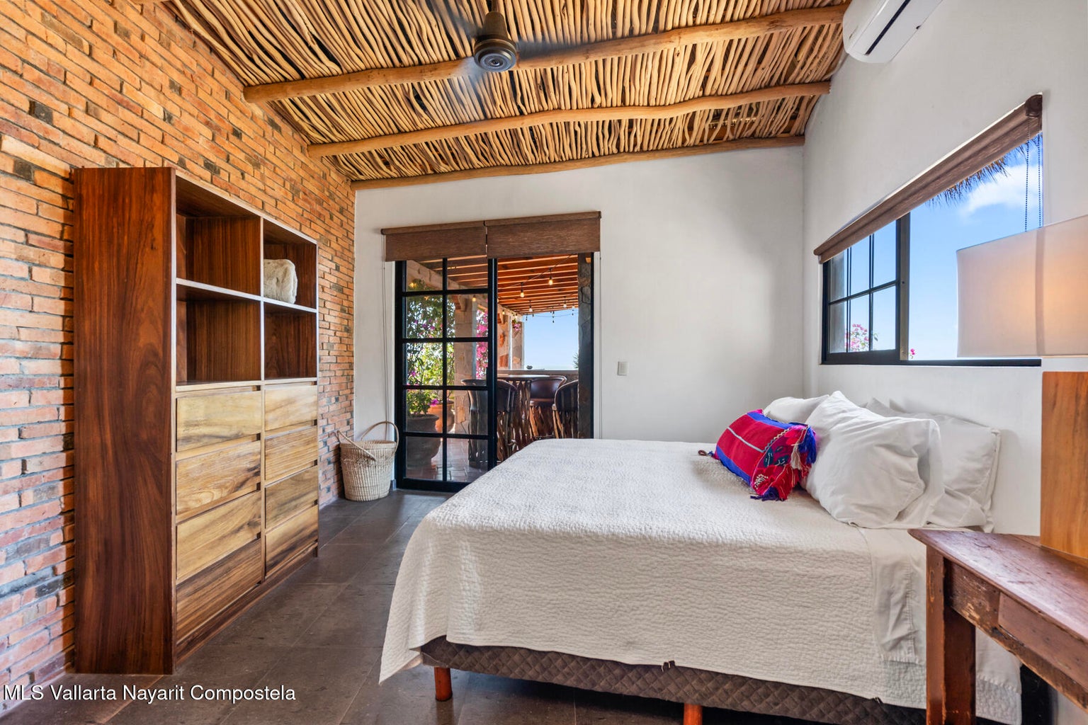 Luxury ocean view home for sale in Nanzal Hill, Sayulita featuring panoramic Pacific Ocean views, tropical landscaping, saltwater pool, rooftop terrace, gourmet kitchen, and elegant indoor-outdoor coastal living in Riviera Nayarit.
