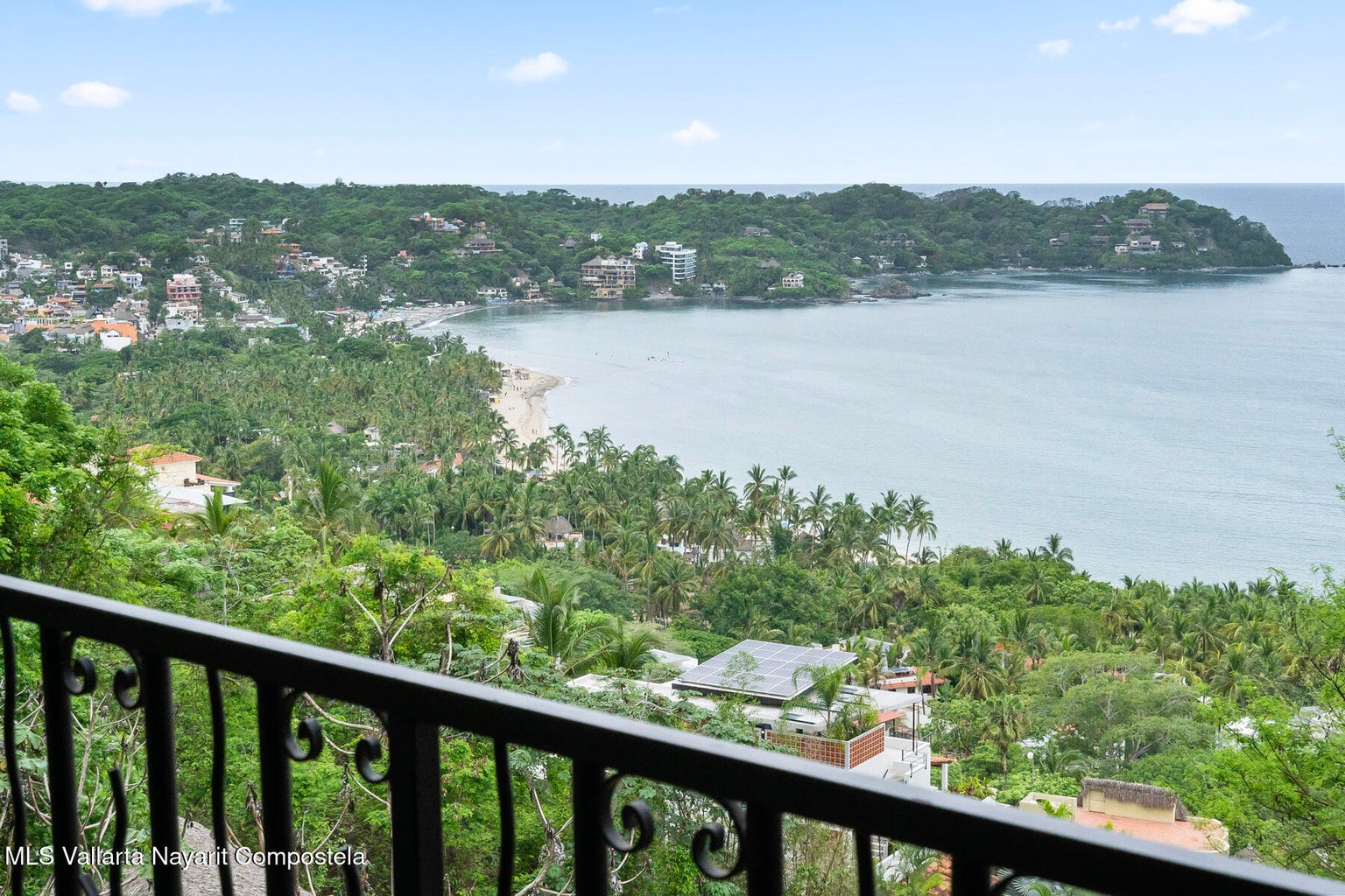 Luxury ocean view home for sale in Nanzal Hill, Sayulita featuring panoramic Pacific Ocean views, tropical landscaping, saltwater pool, rooftop terrace, gourmet kitchen, and elegant indoor-outdoor coastal living in Riviera Nayarit.