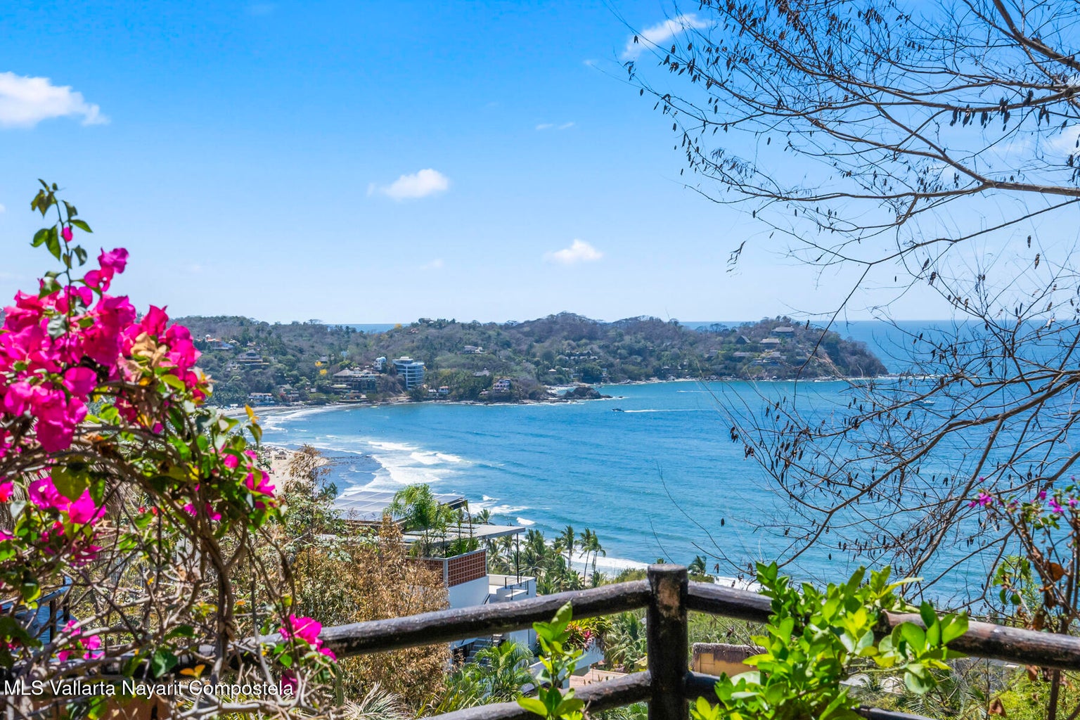 Luxury ocean view home for sale in Nanzal Hill, Sayulita featuring panoramic Pacific Ocean views, tropical landscaping, saltwater pool, rooftop terrace, gourmet kitchen, and elegant indoor-outdoor coastal living in Riviera Nayarit.