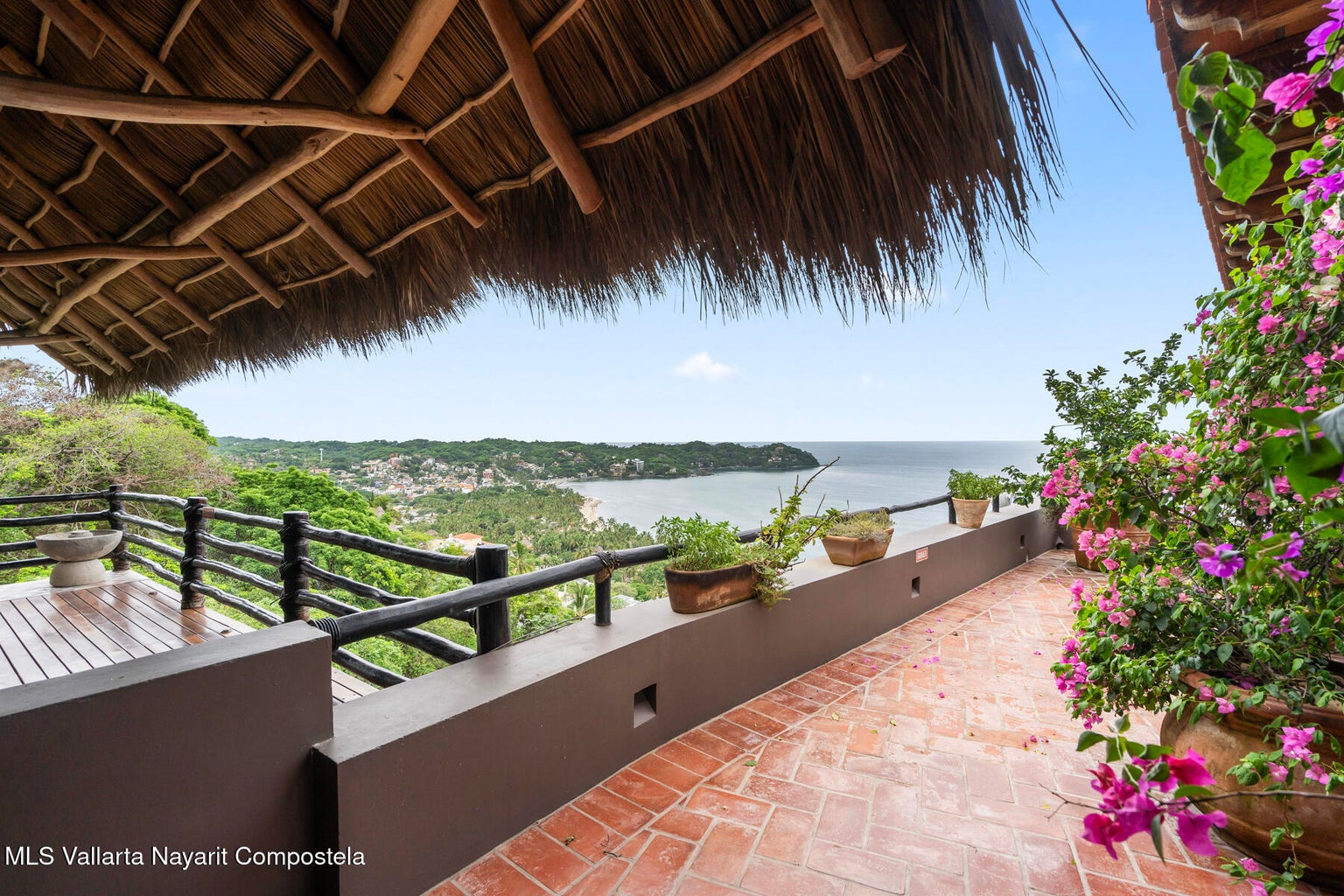Luxury ocean view home for sale in Nanzal Hill, Sayulita featuring panoramic Pacific Ocean views, tropical landscaping, saltwater pool, rooftop terrace, gourmet kitchen, and elegant indoor-outdoor coastal living in Riviera Nayarit.