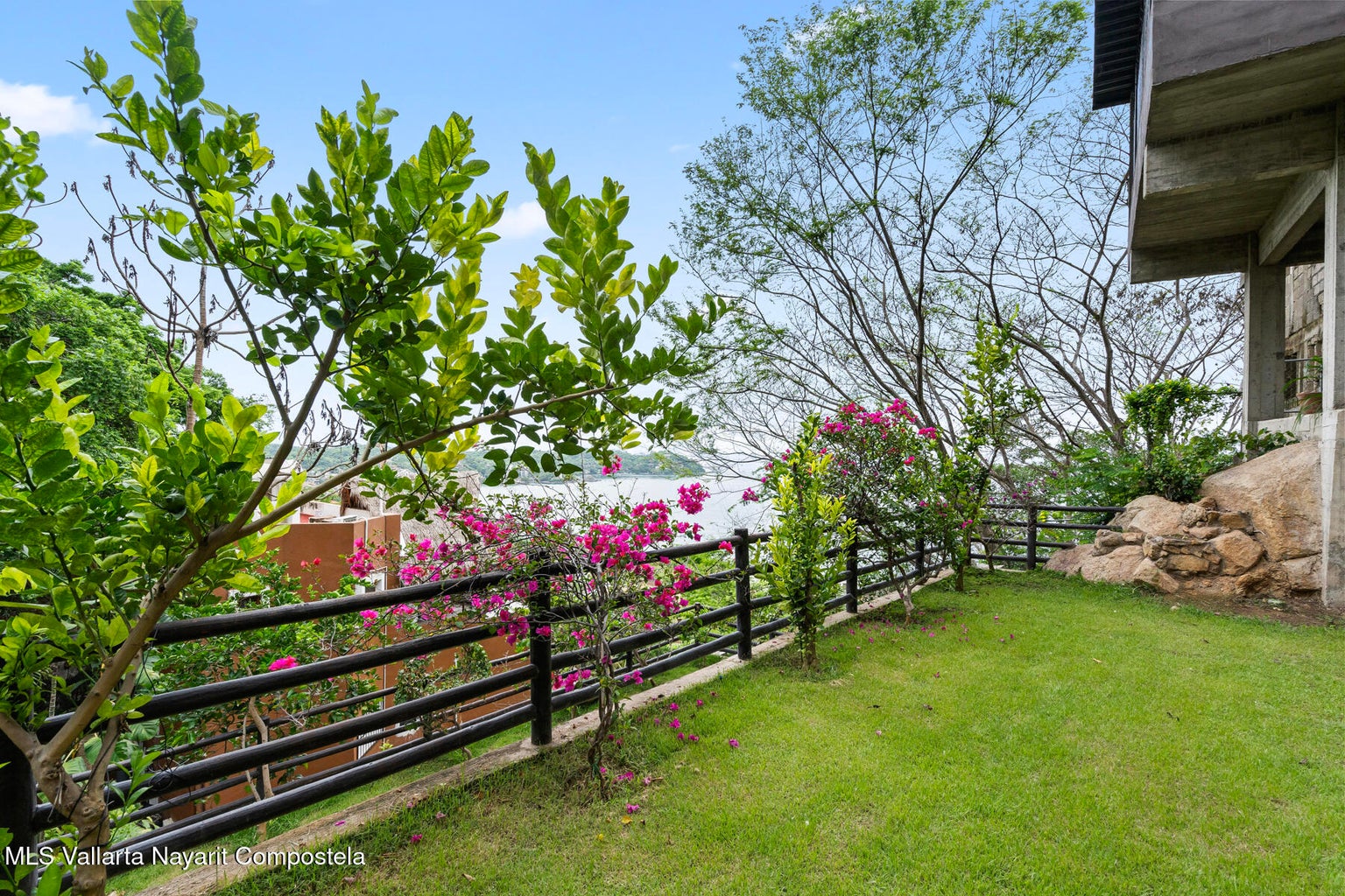 Luxury ocean view home for sale in Nanzal Hill, Sayulita featuring panoramic Pacific Ocean views, tropical landscaping, saltwater pool, rooftop terrace, gourmet kitchen, and elegant indoor-outdoor coastal living in Riviera Nayarit.