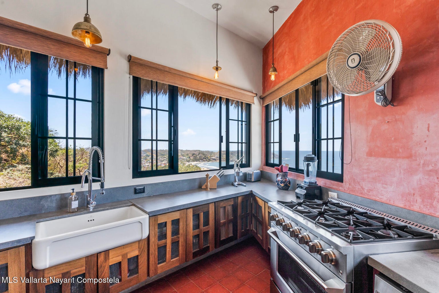Luxury ocean view home for sale in Nanzal Hill, Sayulita featuring panoramic Pacific Ocean views, tropical landscaping, saltwater pool, rooftop terrace, gourmet kitchen, and elegant indoor-outdoor coastal living in Riviera Nayarit.