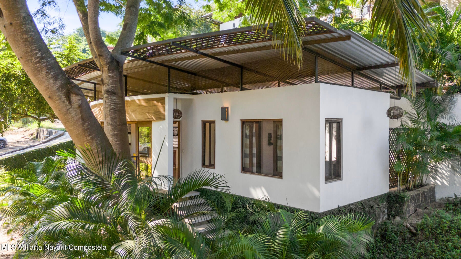 Modern jungle retreat in Sayulita surrounded by tropical parota trees