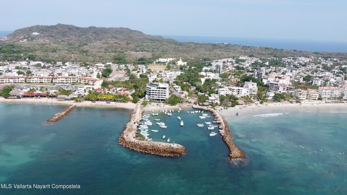 Oceanfront condominium for sale in La Cruz de Huanacaxtle, Riviera Nayarit, featuring panoramic Pacific Ocean views, private balcony, beachfront location, and fully furnished coastal living space.