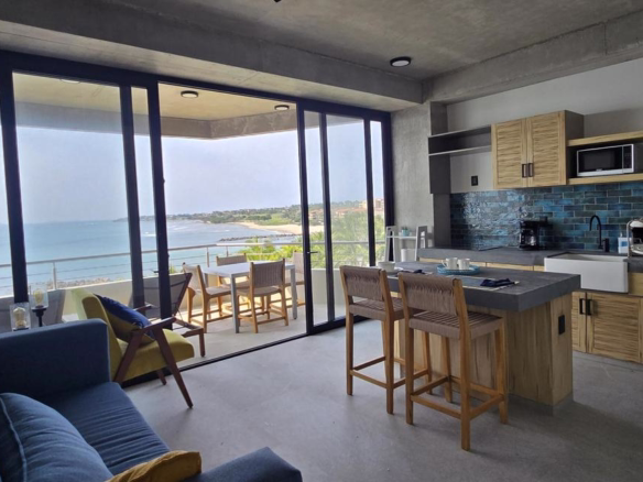 Oceanfront condominium for sale in La Cruz de Huanacaxtle, Riviera Nayarit, featuring panoramic Pacific Ocean views, private balcony, beachfront location, and fully furnished coastal living space.