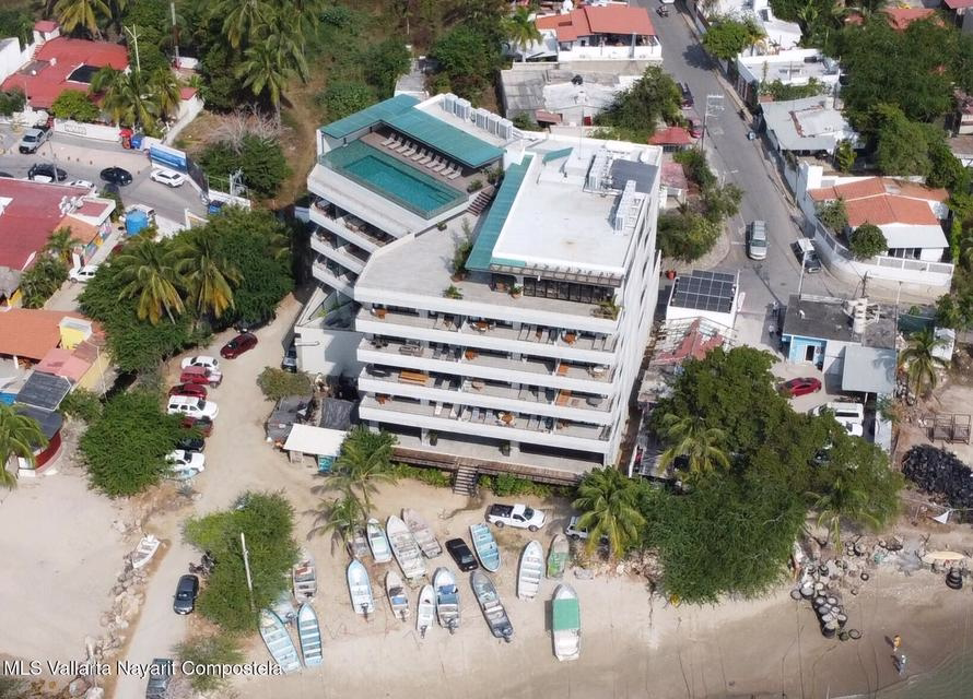 Oceanfront condominium for sale in La Cruz de Huanacaxtle, Riviera Nayarit, featuring panoramic Pacific Ocean views, private balcony, beachfront location, and fully furnished coastal living space.