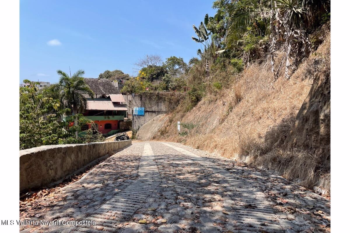 Residential lots for sale on Gringo Hill in Sayulita with utility infrastructure, private road access, and hillside building sites near downtown.
